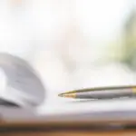 hand with pen application form